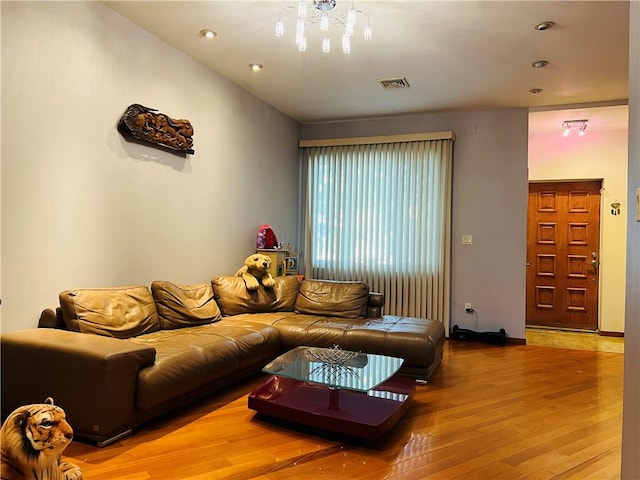 living area featuring visible vents, wood finished floors, and recessed lighting