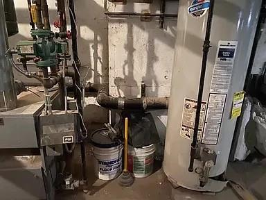 utility room with gas water heater