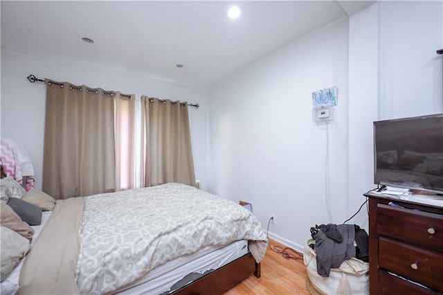 bedroom with wood-type flooring