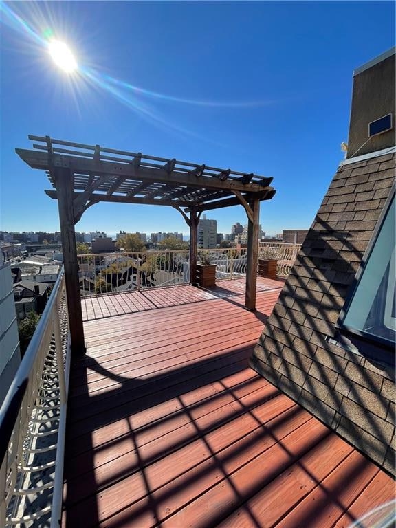 wooden terrace with a pergola