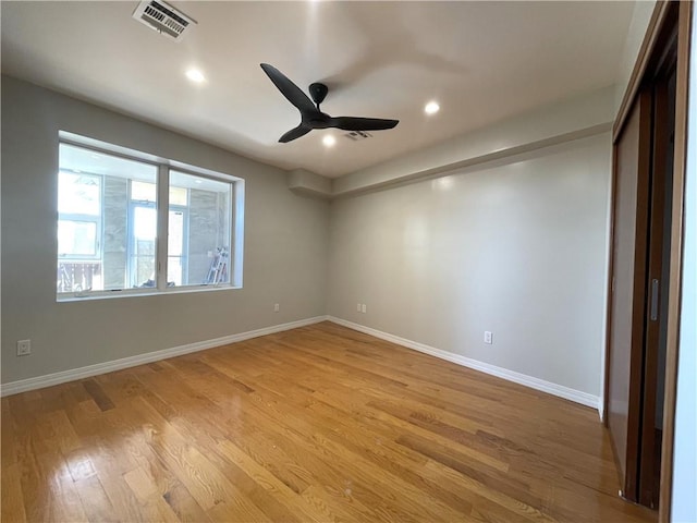 unfurnished room with ceiling fan and light hardwood / wood-style flooring