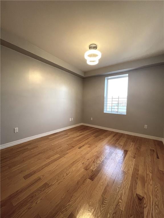 unfurnished room featuring hardwood / wood-style floors