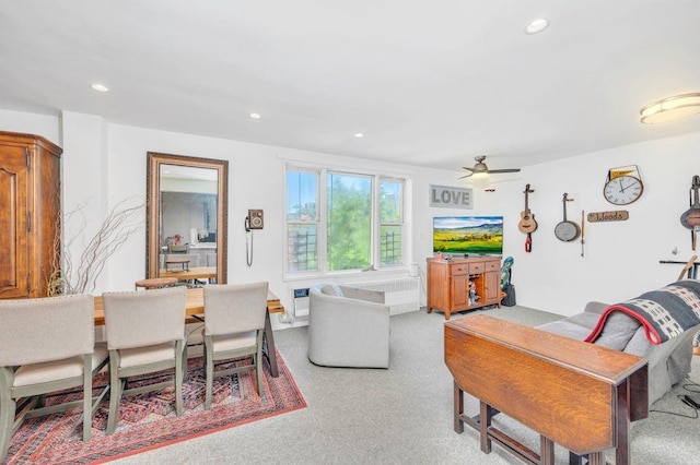 living room featuring carpet floors and ceiling fan