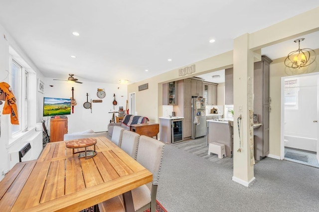 dining area with wine cooler and ceiling fan