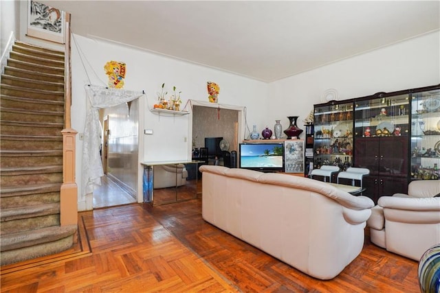 living room featuring parquet floors