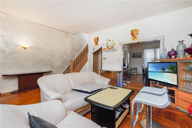 living room featuring parquet floors