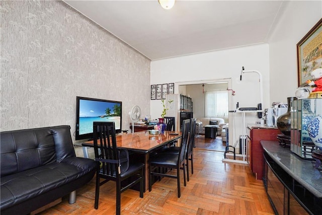 dining room featuring parquet floors