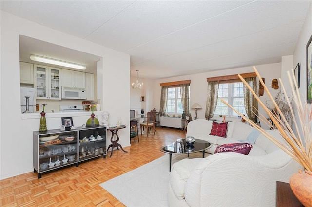 living room with an inviting chandelier