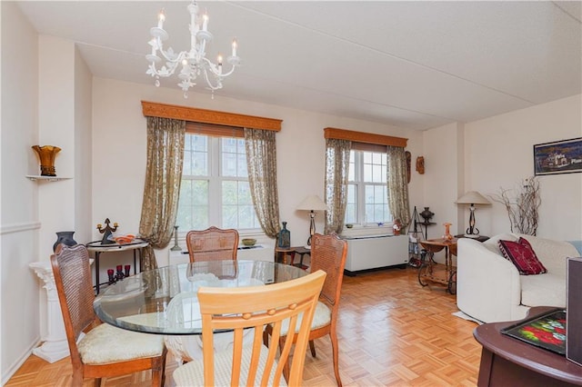 dining area featuring a notable chandelier