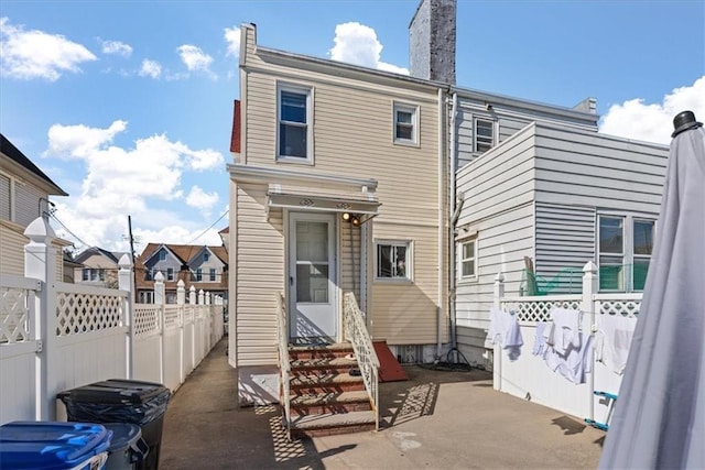 rear view of property featuring a patio