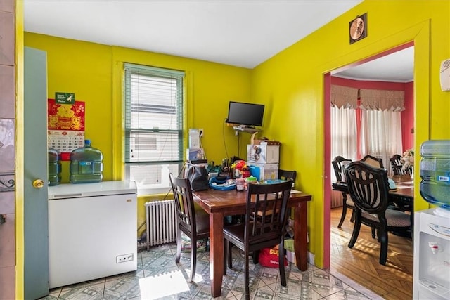 dining area featuring radiator