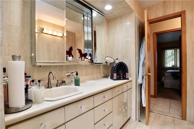 bathroom with vanity and tile patterned flooring