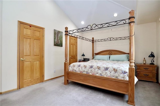 carpeted bedroom featuring high vaulted ceiling