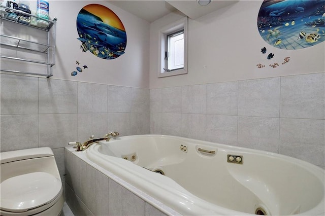 bathroom with tile walls, toilet, and a relaxing tiled tub