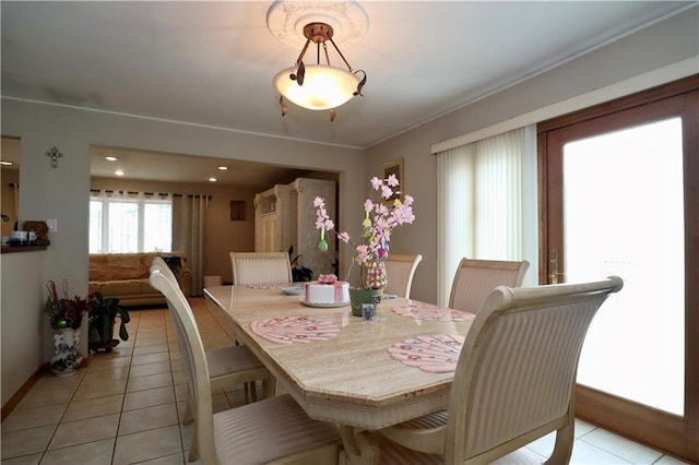 dining area featuring light tile patterned flooring