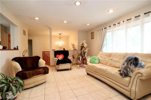 living room with light tile patterned floors and a chandelier