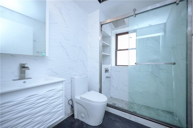 bathroom with vanity, tile walls, toilet, and a marble finish shower