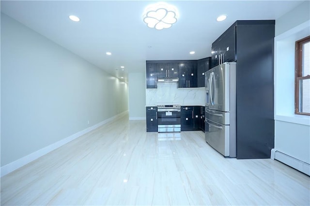 kitchen with under cabinet range hood, backsplash, appliances with stainless steel finishes, and dark cabinets