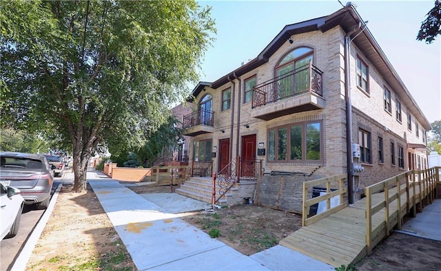 view of property with brick siding