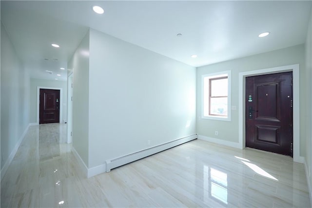 entryway with recessed lighting, baseboards, and a baseboard radiator