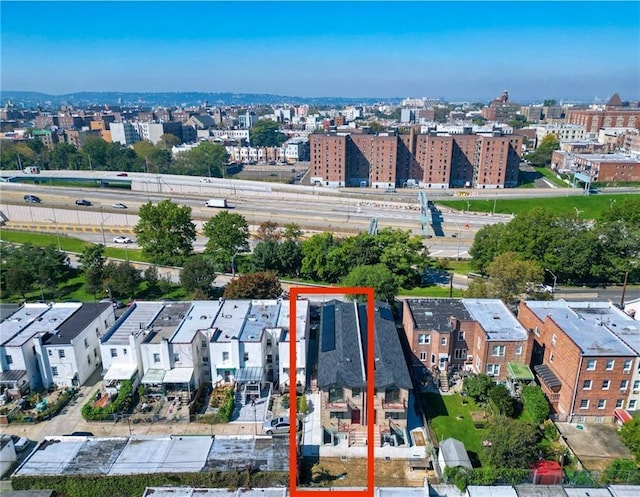 birds eye view of property featuring a city view