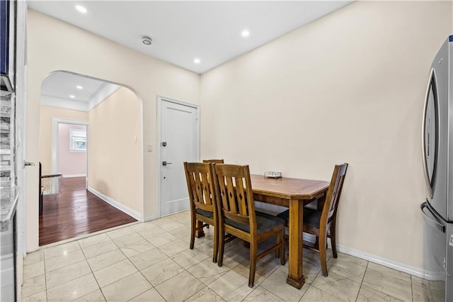 dining space featuring light wood-type flooring