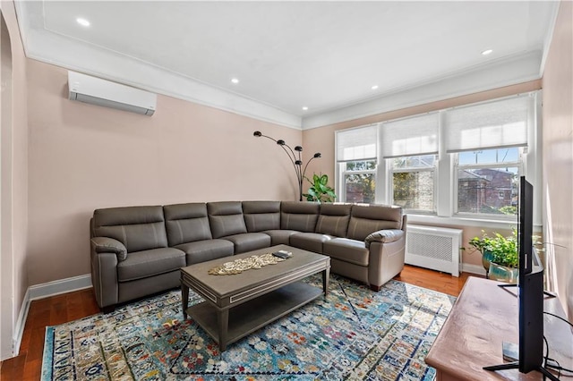 living room featuring a wall unit AC, radiator heating unit, wood-type flooring, and crown molding