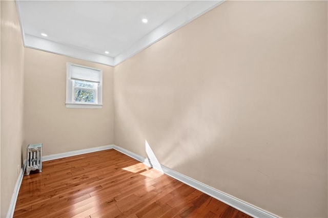 spare room with hardwood / wood-style flooring