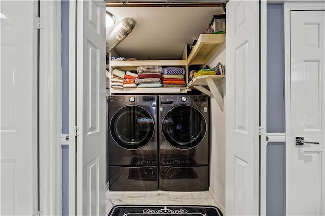 washroom with washer and dryer