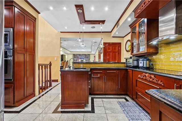 kitchen featuring wall chimney range hood, backsplash, stainless steel appliances, dark stone counters, and pendant lighting