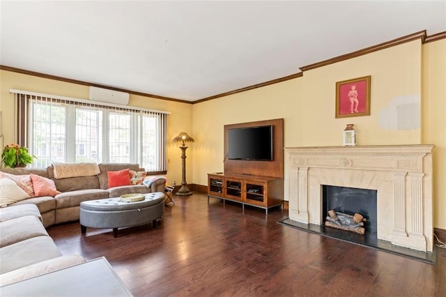 living area with ornamental molding, a premium fireplace, a wall unit AC, and wood finished floors