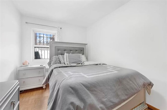 bedroom with parquet flooring