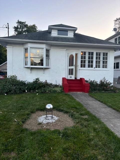 view of front of house with a lawn