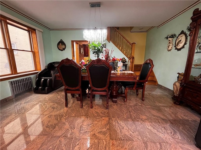 dining space featuring radiator heating unit, ornamental molding, and a chandelier