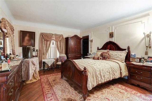 bedroom featuring dark hardwood / wood-style flooring