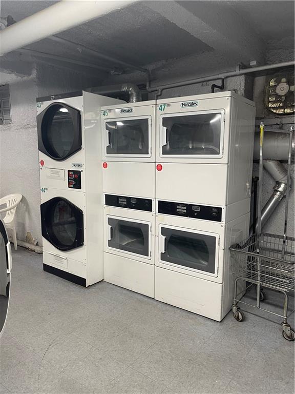 laundry area with separate washer and dryer and stacked washer and dryer