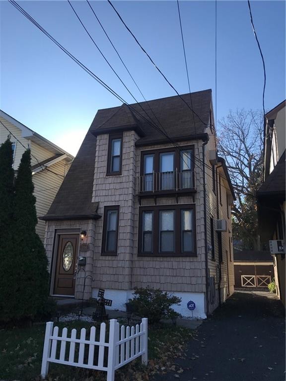 view of front of house with a balcony