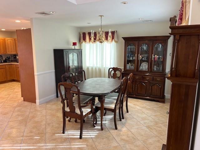 dining area featuring light tile patterned floors, visible vents, recessed lighting, and an inviting chandelier