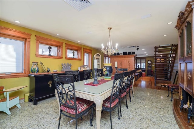 dining space with a chandelier