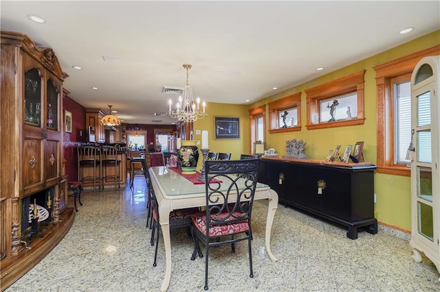 dining area with a chandelier and plenty of natural light