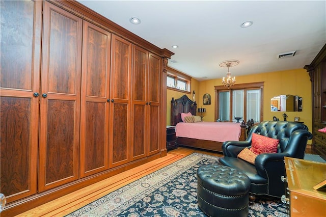 bedroom featuring an inviting chandelier