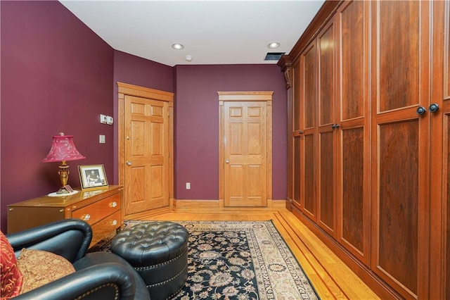 sitting room featuring hardwood / wood-style floors