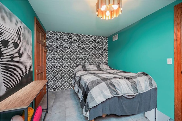 bedroom featuring light tile patterned flooring