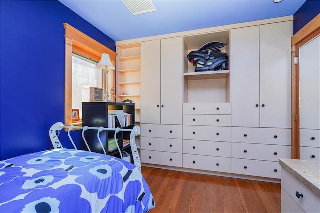 bedroom featuring dark hardwood / wood-style flooring