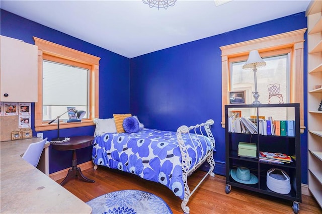 bedroom with wood-type flooring