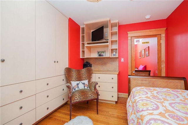 bedroom with light wood-type flooring