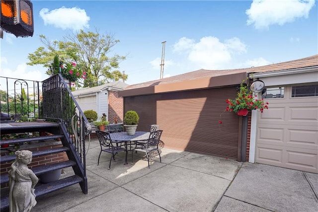 view of patio with a garage