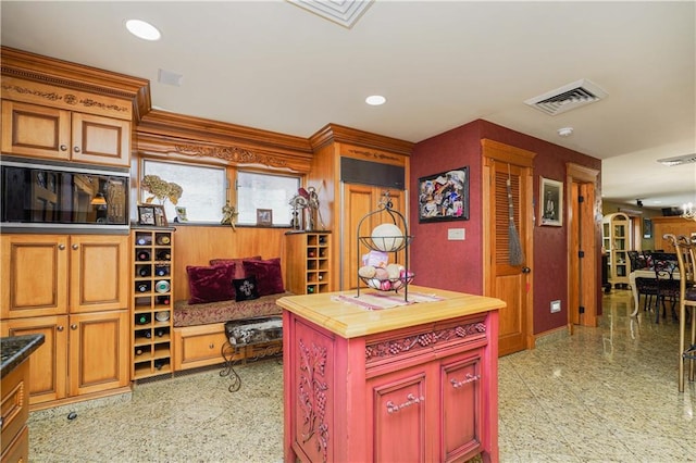 kitchen with a center island and a notable chandelier