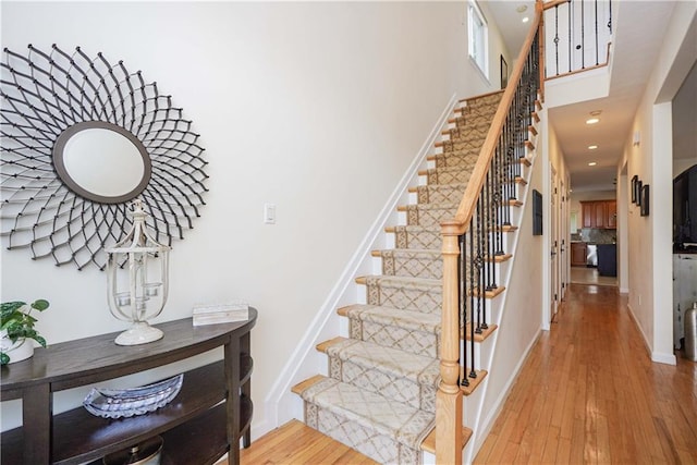 staircase featuring wood-type flooring