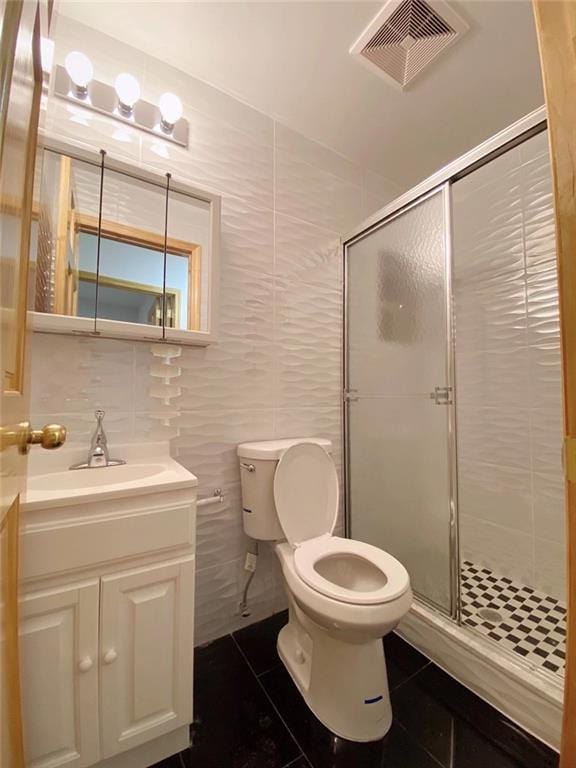 bathroom with walk in shower, tile walls, and toilet